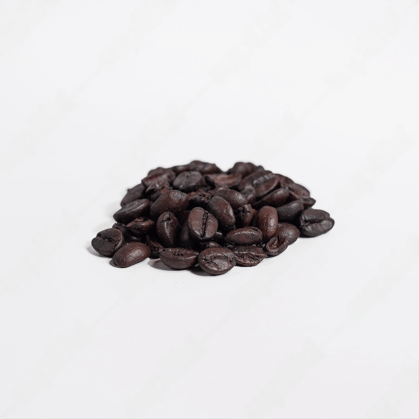 Brazilian Blend Coffee Beans being poured into grinder